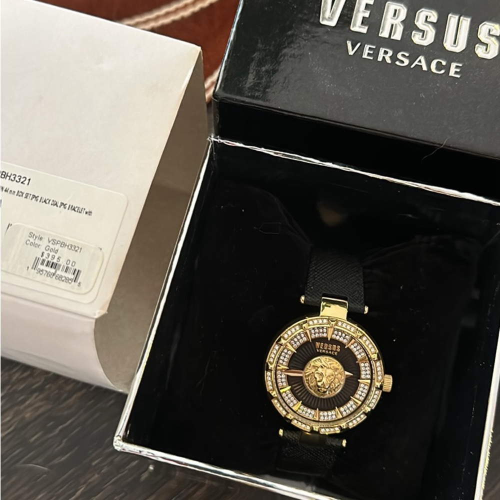 Versace versus women’s Gold & diamond watch. Beautiful black leather band.
